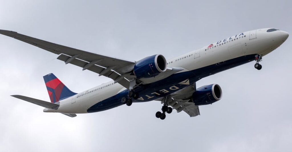 Delta Airlines aircraft in descent over Los Angeles, cloudy sky.