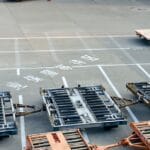 Ground crew and equipment around plane at Guangzhou Airport